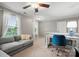 Upstairs loft area with neutral carpet, windows and comfortable seating plus a desk at 3039 Keswick Ter, Indian Land, SC 29707