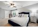 Cozy main bedroom showcasing a ceiling fan, queen size bed, and an additional chair for seating at 3039 Keswick Ter, Indian Land, SC 29707
