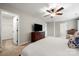 Spacious main bedroom featuring a ceiling fan, TV, and ample closet space at 3039 Keswick Ter, Indian Land, SC 29707