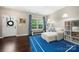 Cozy sitting area with a comfortable chaise lounge, a bright blue rug, and built-in bookshelves at 3039 Keswick Ter, Indian Land, SC 29707