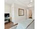 Bedroom with desk, chair, and a stairway visible from the doorway at 3064 Selwyn Ave, Charlotte, NC 28209