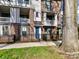 Attractive brick townhomes featuring fenced yards, covered balconies, and inviting curb appeal at 3064 Selwyn Ave, Charlotte, NC 28209