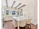 Bright, all-white kitchen with hardwood floors, marble island, modern appliances, and stylish lighting at 3064 Selwyn Ave, Charlotte, NC 28209