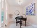 Bright music room featuring a piano, modern decor, and large window with natural light at 3064 Selwyn Ave, Charlotte, NC 28209