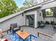 Charming rooftop deck featuring comfortable seating, modern lighting, and a peek at the sky through an opening at 3064 Selwyn Ave, Charlotte, NC 28209