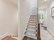Stairway with a carpet runner that leads to the bedrooms and hallway at 3064 Selwyn Ave, Charlotte, NC 28209