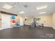 Bright, expansive gym with modern equipment, including a multi-station machine and exercise balls at 3129 Burnello Ct, Iron Station, NC 28080
