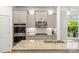 Kitchen with granite countertops, stainless steel appliances, and modern lighting at 3129 Burnello Ct, Iron Station, NC 28080