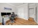 Home office features hardwood floors, neutral walls, and dual monitors on the desk at 3129 Burnello Ct, Iron Station, NC 28080