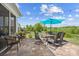 Inviting patio features stylish outdoor furniture, string lights, and a serene backyard view, ideal for entertaining and relaxation at 3129 Burnello Ct, Iron Station, NC 28080