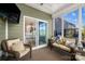 Cozy sunroom with comfortable seating, large windows, and views of the backyard at 3129 Burnello Ct, Iron Station, NC 28080