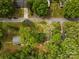 Aerial view of the home in a verdant neighborhood with mature trees and greenery at 313 Villa St, Kannapolis, NC 28083