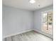 Bedroom with a window allowing natural light and wood-look floors at 313 Villa St, Kannapolis, NC 28083