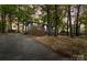 Charming single-story home features a new front porch, blue siding, and mature trees, offering a peaceful setting at 313 Villa St, Kannapolis, NC 28083