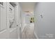 Hallway with laundry area and views into the main living area at 313 Villa St, Kannapolis, NC 28083