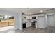 Bright kitchen with stainless steel appliances, white cabinets, and an adjacent dining area, perfect for modern living at 313 Villa St, Kannapolis, NC 28083