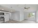Open-concept living room features vaulted ceilings, large windows, and modern flooring with adjacent kitchen at 313 Villa St, Kannapolis, NC 28083
