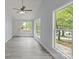 Bright living room with many windows, modern flooring and neutral wall color at 313 Villa St, Kannapolis, NC 28083