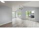 Sunlit living room with multiple windows and wood-look flooring, creating a bright space at 313 Villa St, Kannapolis, NC 28083