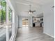 Open-concept living room features vaulted ceilings, large windows, and modern flooring with adjacent kitchen at 313 Villa St, Kannapolis, NC 28083