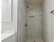 Bathroom boasts marble-style tiled shower with sleek fixtures and a convenient toiletry niche at 313 Villa St, Kannapolis, NC 28083