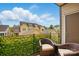 A cozy balcony set with seating offering a serene outdoor retreat with views of the surrounding neighborhood at 3216 Moss Ln, Charlotte, NC 28206