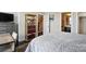 Bedroom featuring a decorative bookshelf, walk-in closet, and a view towards the hallway at 3216 Moss Ln, Charlotte, NC 28206
