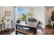 A bright dining room has large windows and a modern table, making it perfect for Gathering meals at 3216 Moss Ln, Charlotte, NC 28206