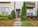 Inviting front entrance with a decorative wreath, manicured landscaping, and a well-maintained walkway at 3216 Moss Ln, Charlotte, NC 28206