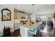 Kitchen boasting an island with barstool seating, modern appliances, and pendant lighting fixtures at 3216 Moss Ln, Charlotte, NC 28206