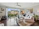 Bright living room featuring a plush sectional sofa, a sliding glass door to a patio, and modern furnishings at 3216 Moss Ln, Charlotte, NC 28206