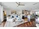 Open-concept living room with hardwood floors, comfortable seating, and stylish decor with access to the kitchen at 3216 Moss Ln, Charlotte, NC 28206