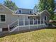 Home's backyard featuring a spacious deck, perfect for outdoor entertaining at 3824 Freedom Dr, Charlotte, NC 28208