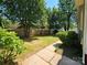Home's expansive backyard, offering ample green space and a peaceful setting at 3824 Freedom Dr, Charlotte, NC 28208