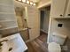 Bright bathroom featuring modern fixtures, wood-look flooring, and shelving at 3824 Freedom Dr, Charlotte, NC 28208