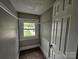 This walk-in closet features carpeted floors, a high window and a wire rack for extra storage at 3824 Freedom Dr, Charlotte, NC 28208