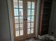 Elegant French doors offer a seamless transition to an additional room with natural light and stylish design at 3824 Freedom Dr, Charlotte, NC 28208