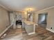 Contemporary kitchen with gray cabinets, an island with granite countertops, and modern appliances at 3824 Freedom Dr, Charlotte, NC 28208