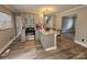 Modern kitchen with gray cabinets, granite countertops, an island, and stainless steel appliances at 3824 Freedom Dr, Charlotte, NC 28208