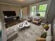 Comfortable living room featuring a plush couch, modern furniture, and ample natural light at 3824 Freedom Dr, Charlotte, NC 28208