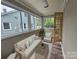 Bright sunroom with lots of windows, a comfortable couch, and relaxing atmosphere at 3824 Freedom Dr, Charlotte, NC 28208
