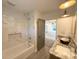 Bathroom featuring modern fixtures, tile surround, and neutral colors at 401 Baker St, Gastonia, NC 28052
