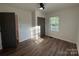 Bedroom with hardwood floors, neutral walls, and closet at 401 Baker St, Gastonia, NC 28052