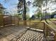 Wooden deck with lattice railing, offering great outdoor space and backyard views at 401 Baker St, Gastonia, NC 28052