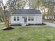 Charming single-story home features new siding, freshly landscaped yard, and a welcoming front entrance at 401 Baker St, Gastonia, NC 28052
