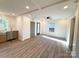 Open-concept living room with hardwood floors, and natural light at 401 Baker St, Gastonia, NC 28052