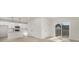Open-concept living space with kitchen, sleek flooring, and natural light at 405 Durham Ave, Statesville, NC 28677