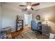 This room features hardwood floors, ceiling fan, and has neutral paint providing a relaxing space at 4224 Firwood Ln, Charlotte, NC 28209