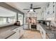 Modern kitchen features white cabinets, stainless steel appliances, and tile flooring at 4224 Firwood Ln, Charlotte, NC 28209
