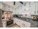 Bright kitchen with white cabinets, stainless steel appliances, and modern countertops at 4224 Firwood Ln, Charlotte, NC 28209